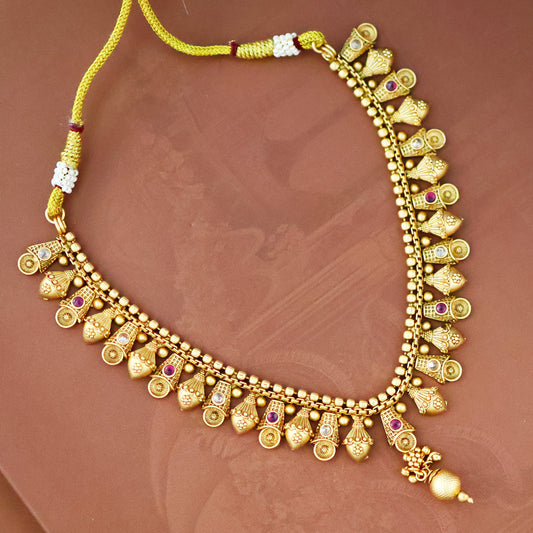 Manvi Gold tone ruby necklace set